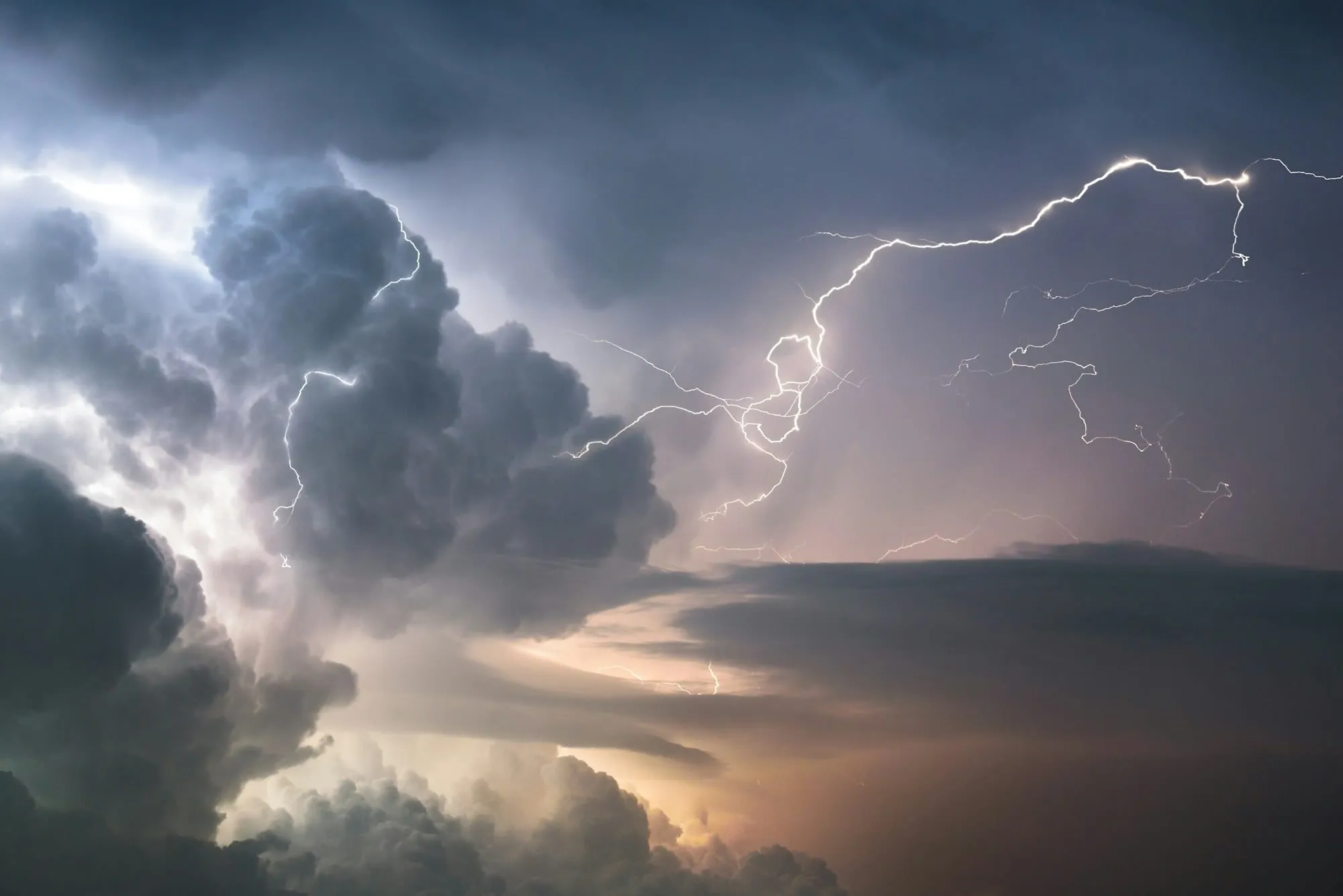 Lightning striking from dark storm clouds